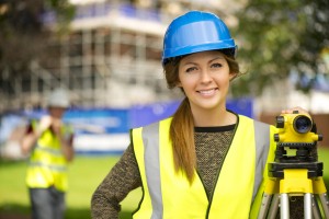 female land surveyor smiling at camera