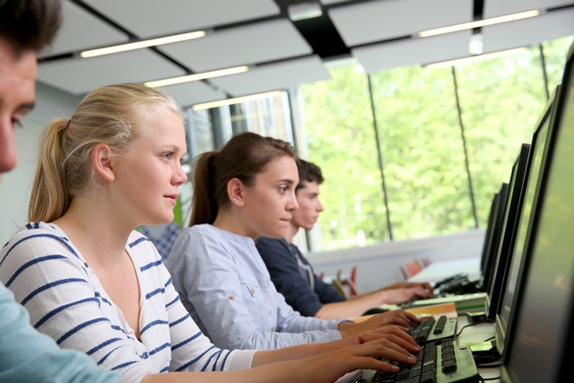 High school students working in a computer lab