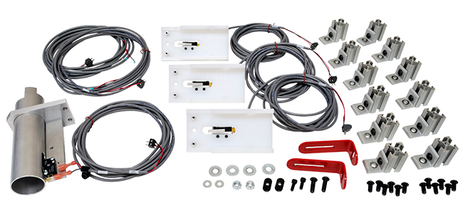 Electrical wiring kit including three white control boxes, numerous black cables with connectors, mounting hardware, and red L-shaped wrenches.