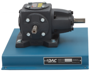 Industrial gear reducer mounted on a blue stand with bolts and a label reading DAC Training That Works on the front.