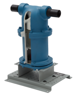 Blue industrial valve actuator mounted on a gray perforated base plate with black pipe fittings on either side.