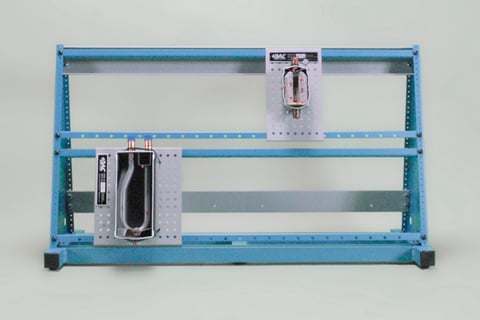 Blue metal frame with two mounted electrical panels and exposed wiring.
