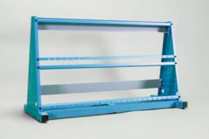 Blue metal frame rack with three parallel horizontal bars on a flat base against a light background, likely for holding long parts or shelves.