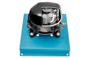 Air conditioner compressor with exposed internal components mounted on a blue base plate.