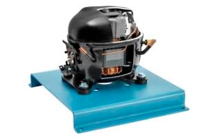 Black compressor motor with exposed copper windings mounted on a blue metal base plate