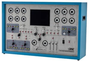 Blue metal-framed electrical generator control panel with many analog gauges, switches, and a central display screen.