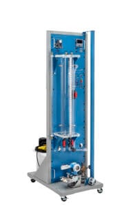 Blue industrial control panel on a tall wheeled stand with gauges, valves, and tubing to illustrate a process rig.