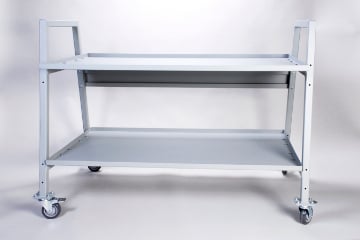 Metal rolling cart with two shelves on four wheels, suitable for workshop storage.