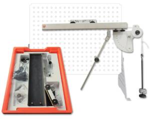 Perforated white board with a long metal bar and a protractor-style clamp on the right, connected by a rod, alongside an open orange toolbox containing small parts.