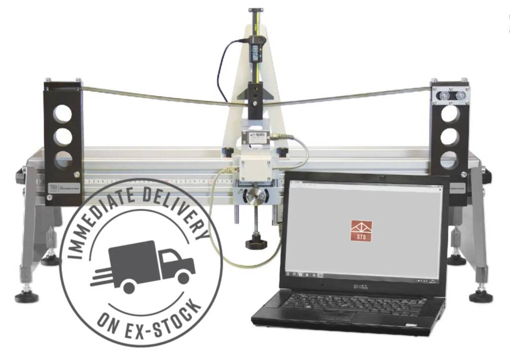 Industrial CNC motion-stage setup with horizontal rails, a central vertical actuator and a laptop showing control software (on-stock stamp watermark)