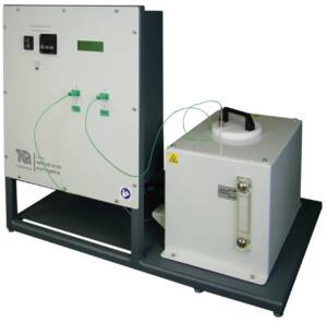 Lab heat-transfer test rig with a control panel and a connected reservoir linked by green tubing.