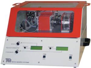 Bench-top geared test rig (TM1018 Geared Systems) with red enclosure and exposed gears inside, used for dynamometer testing.