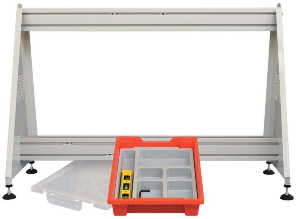 Metal workbench with an orange plastic tool organizer and multiple small compartments resting on the front tray.