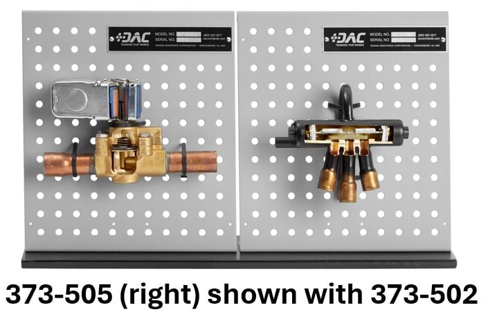 Two industrial valve assemblies mounted on perforated metal panels, with copper and brass fittings on display.